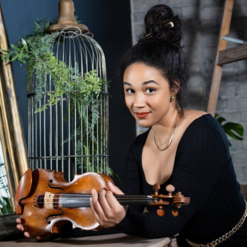 Image of Adé Williams posed with violin