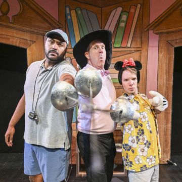 three goofy men pointing foils at camera