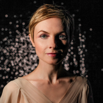 white woman with sparkly background