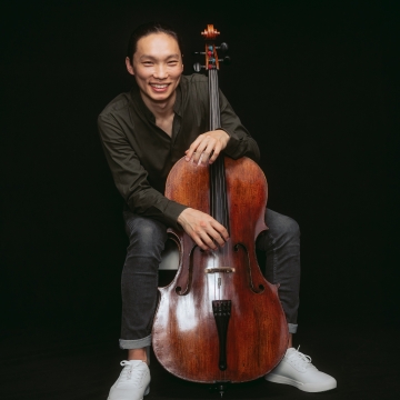 man holding cello
