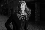black and white serious photo of Suzanne Vega