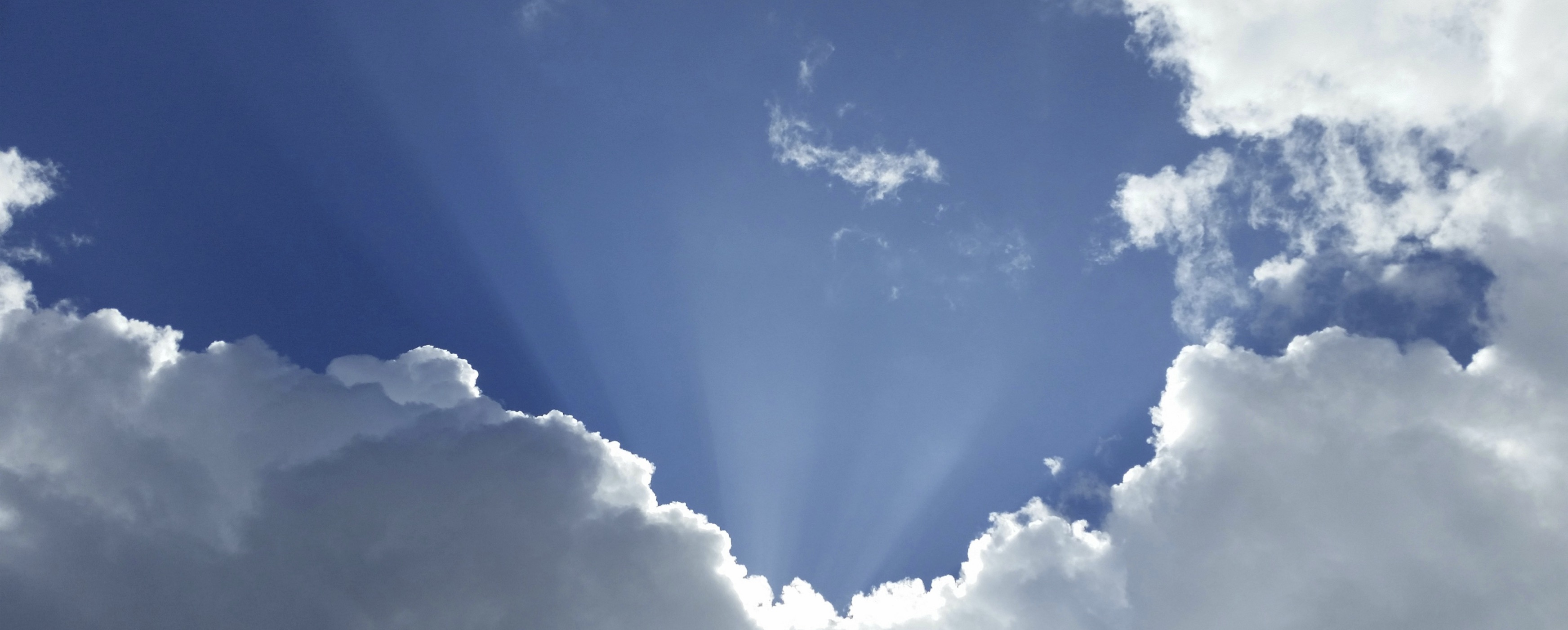image of sunlight coming upward through clouds