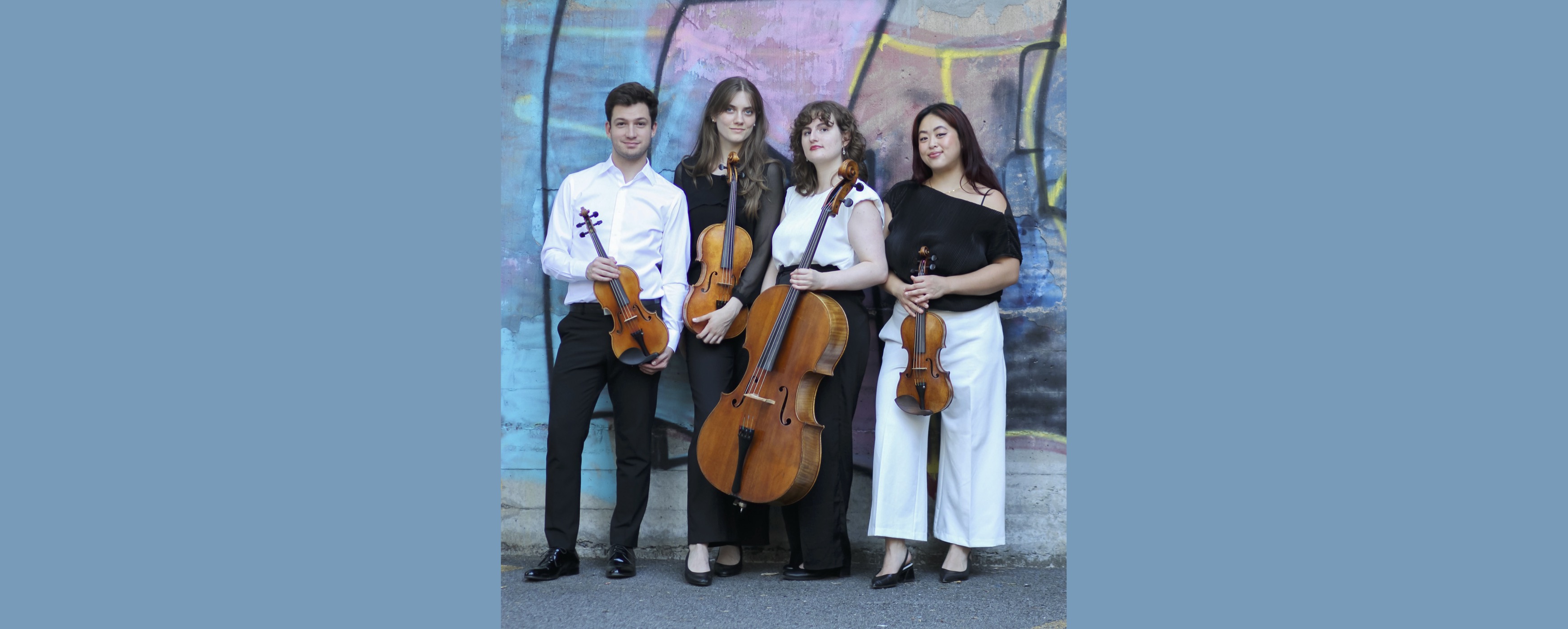 image of Katarina String Quartet in front of graffitied wall