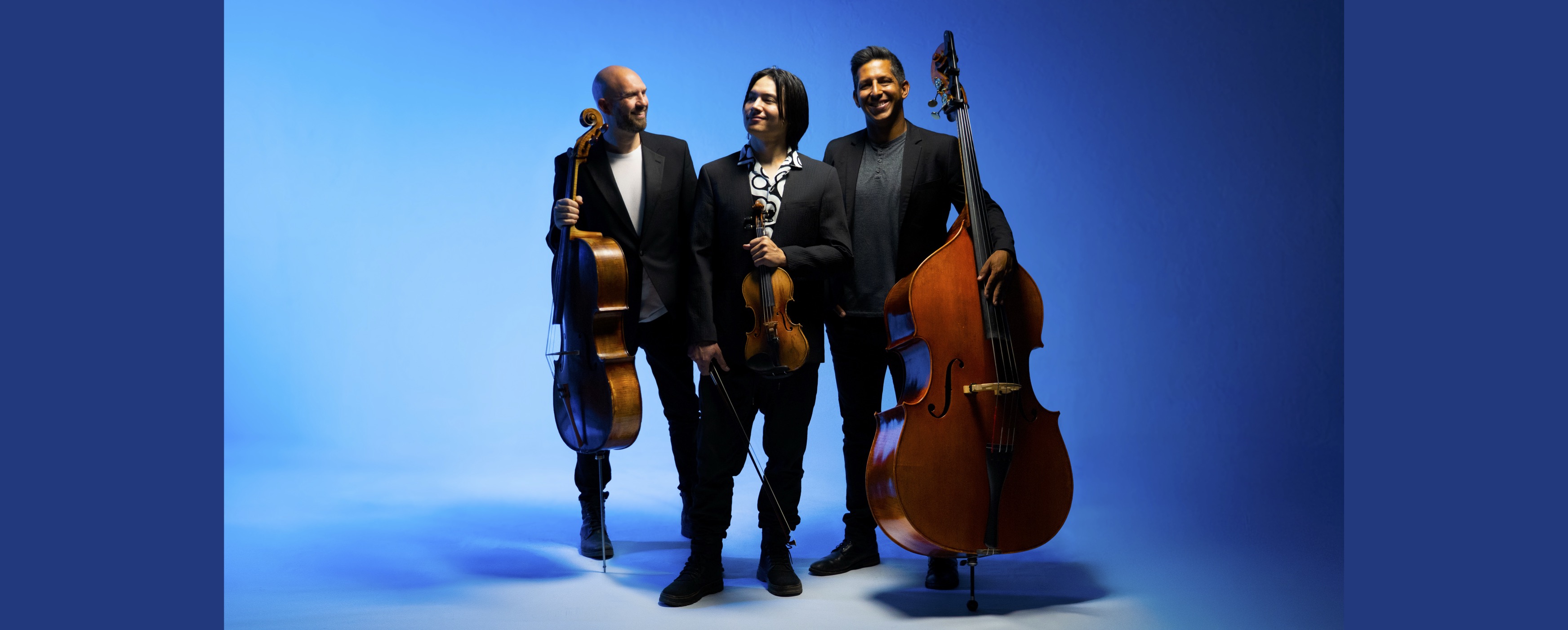 image of three instrumentalists on a blue background