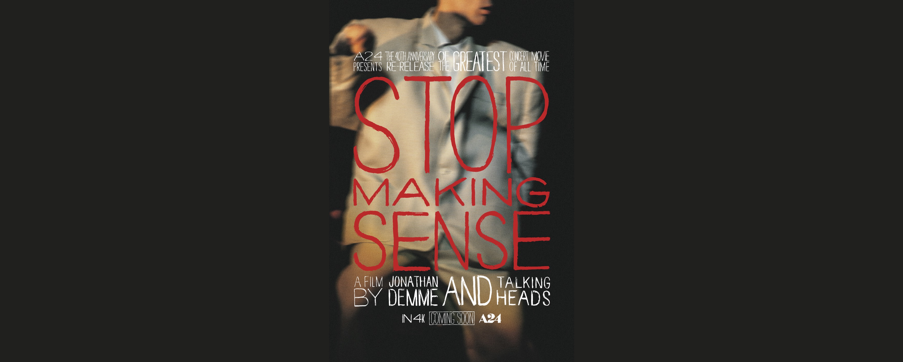 Image of David Byrne's suit in concert with "Stop Making Sense" red text overlaid