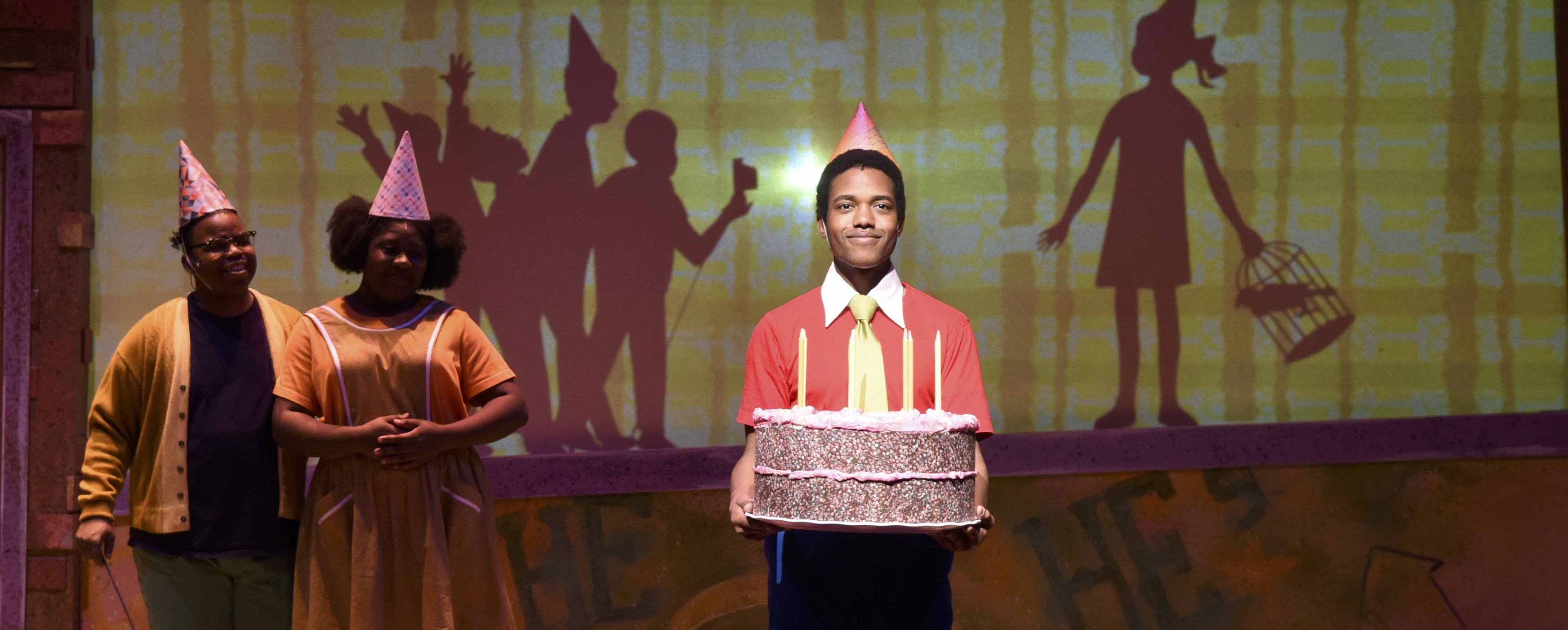 Image of boy with birthday cake and celebration