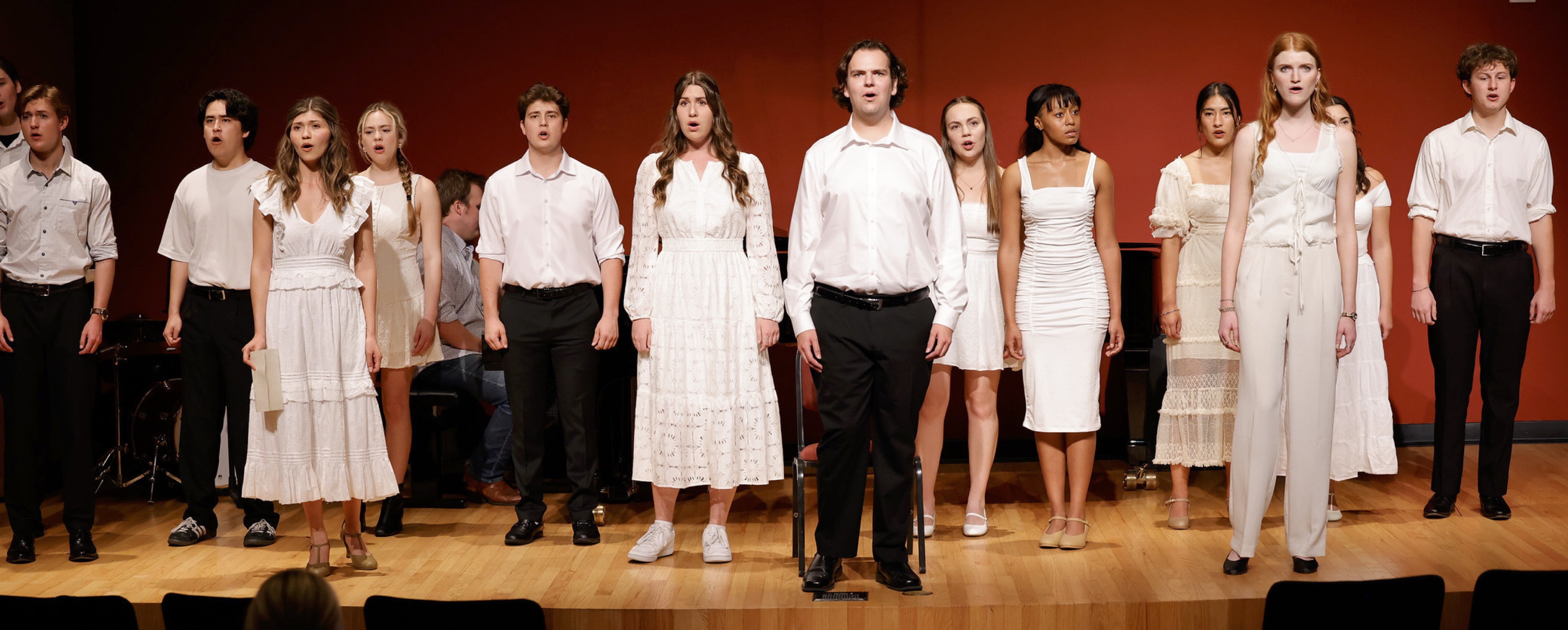 image of student performers singing onstage