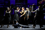 Image of singers in jazzy outfits dancing onstage
