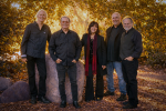 Back to the Garden members pose in an autumnal forest