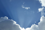 image of clouds with sun coming through
