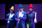 Flying Karamazov brothers pose in funny hats in primary colors