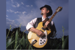 Roger McGuinn holding a guitar
