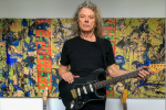 Jerry Harrison holding a guitar