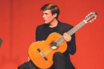 Image of student with guitar